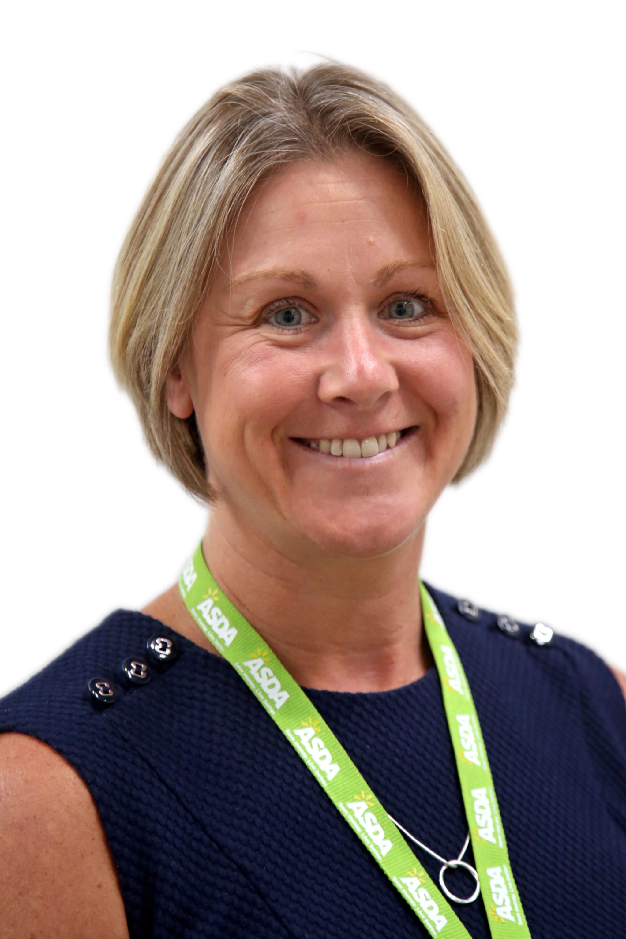 Connelee Usher smiling, in a navy blue dress with an Asda branded lanyard around her neck